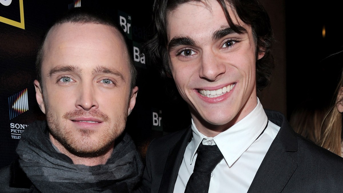 Aaron Paul and RJ Mitte smiling together at a Breaking Bad event
