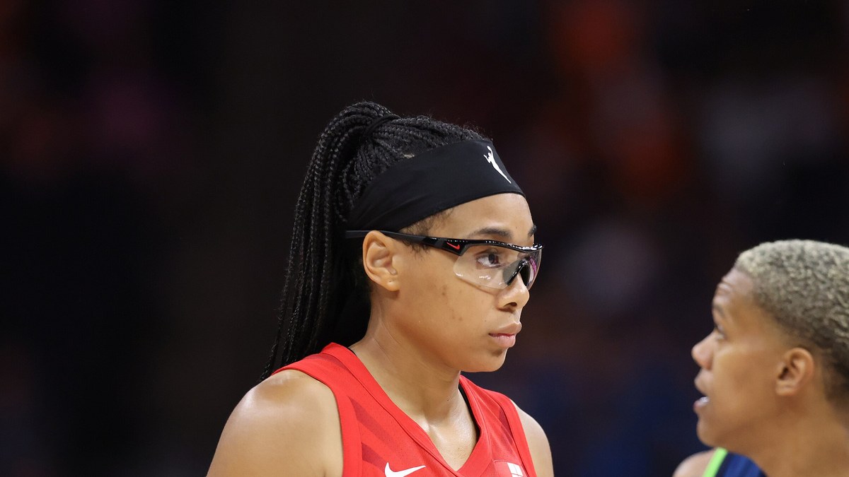 Allisha Gray in a red Atlanta Dream jersey and sports goggles during a game