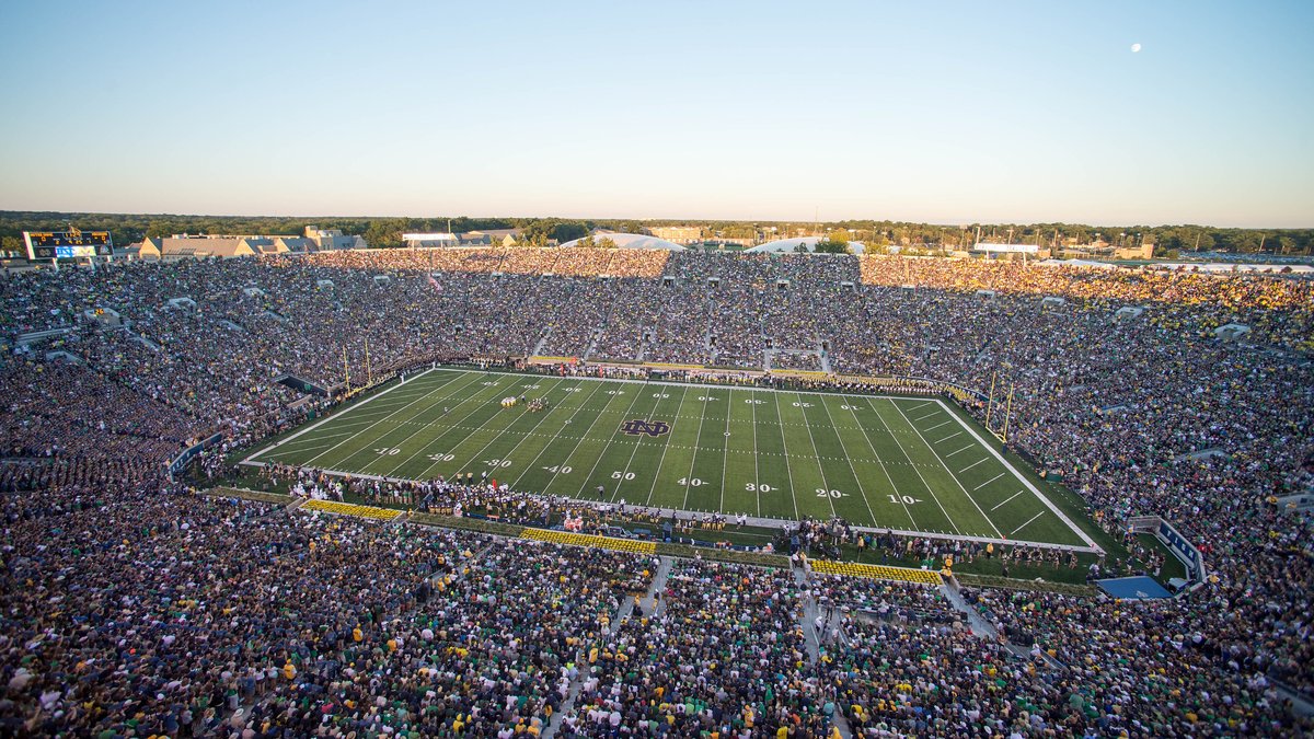 A packed Notre Dame Stadium with fans filling the stands around the field before a September 2014 football game