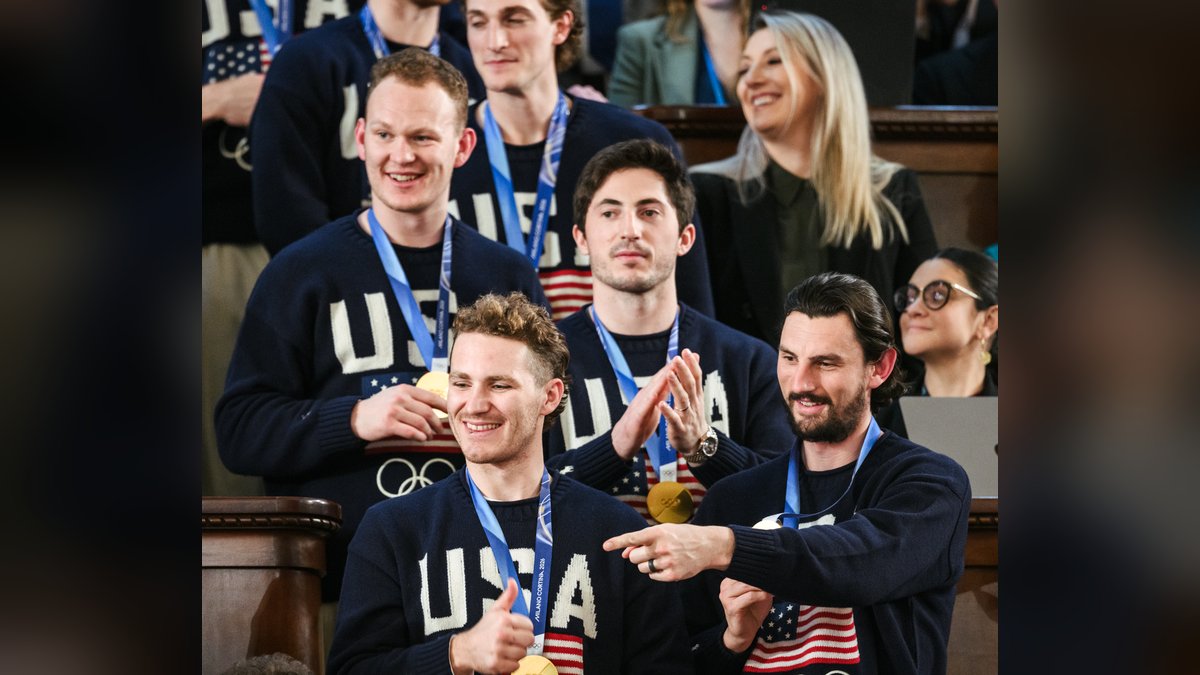 Brady Tkachuk, Matthew Tkachuk and fellow U.S. Olympic hockey gold medalists smiling in USA sweaters at the Capitol in February 2026