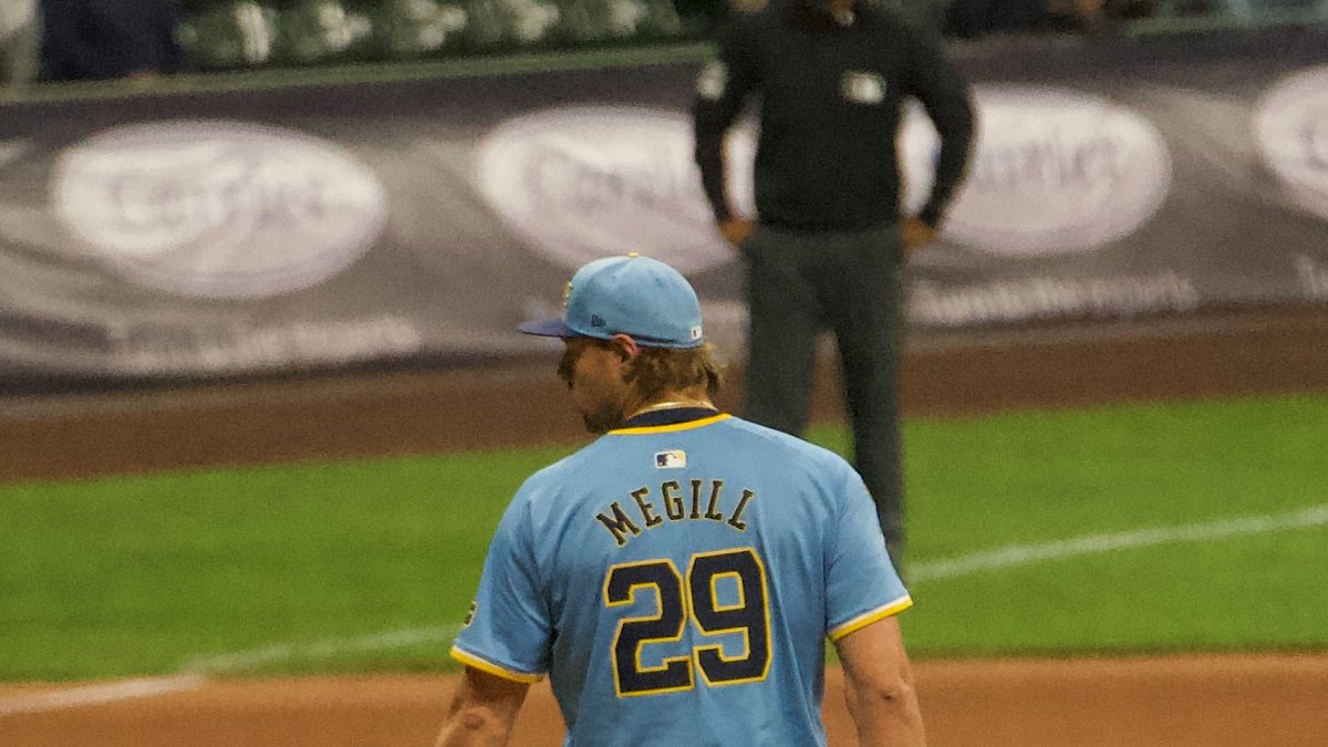 Brewers closer Trevor Megill, wearing No. 29, stands on the mound in a powder blue Milwaukee jersey