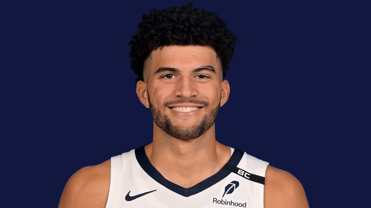 Cameron Boozer smiling in a white Memphis Grizzlies jersey