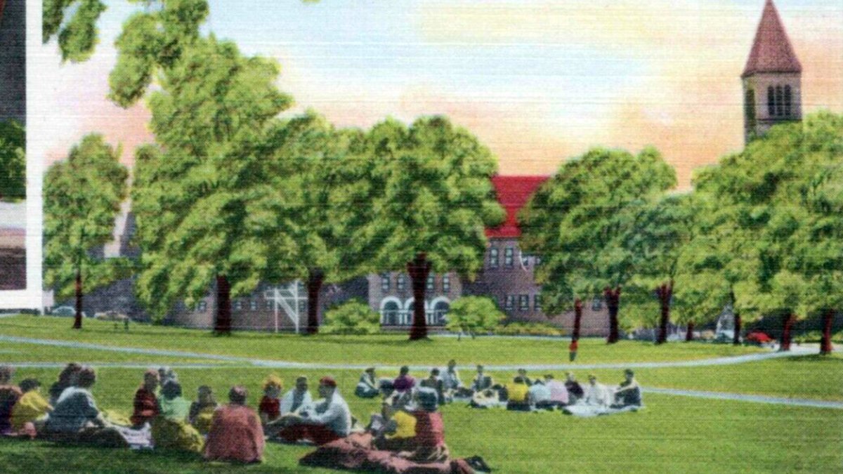 Vintage postcard of students gathered on the lawn of Cornell's Arts Quad