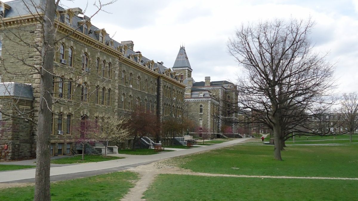 Stone halls and bare trees along a lawn on the Cornell University Arts Quad