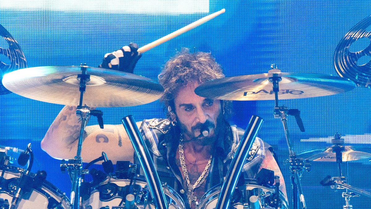 Deen Castronovo playing drums on stage with Journey