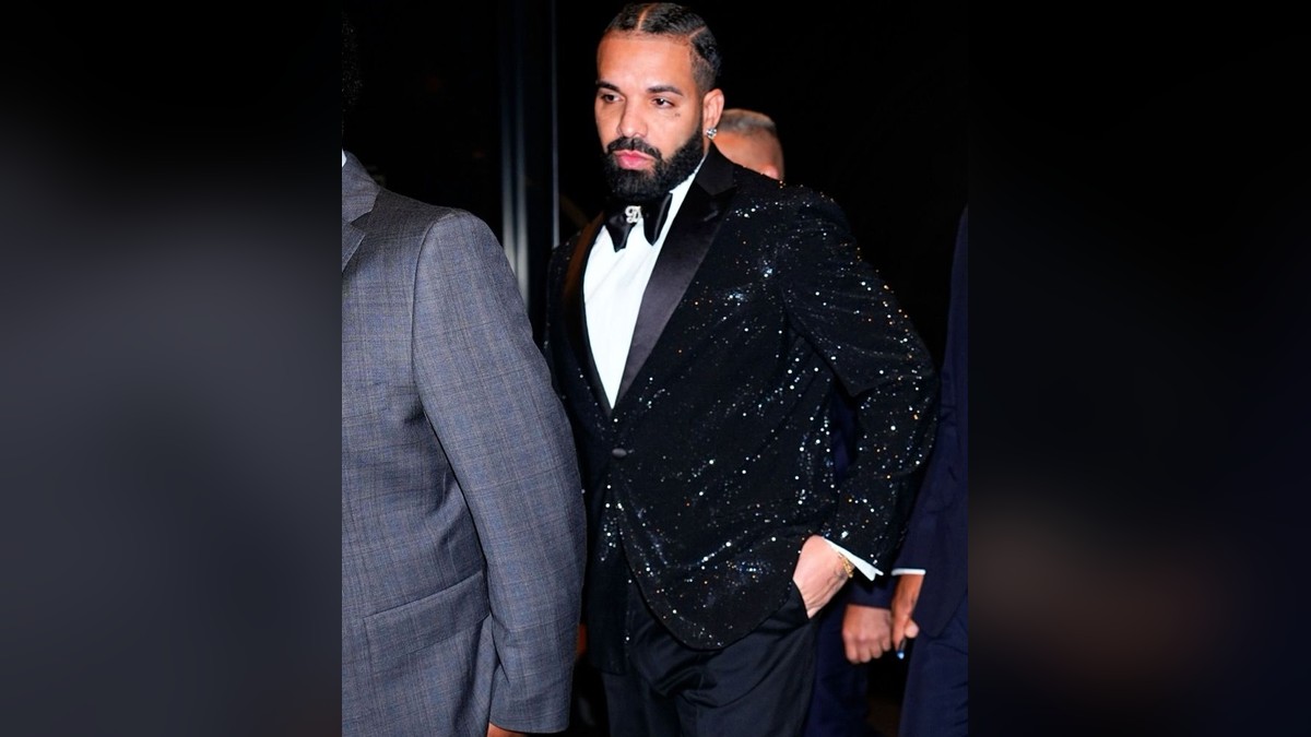 Drake in a sparkly black tuxedo arriving at his 40th birthday party in New York