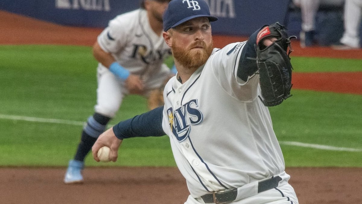 Tampa Bay Rays pitcher Drew Rasmussen delivers a pitch in a white home uniform during a game in June 2026