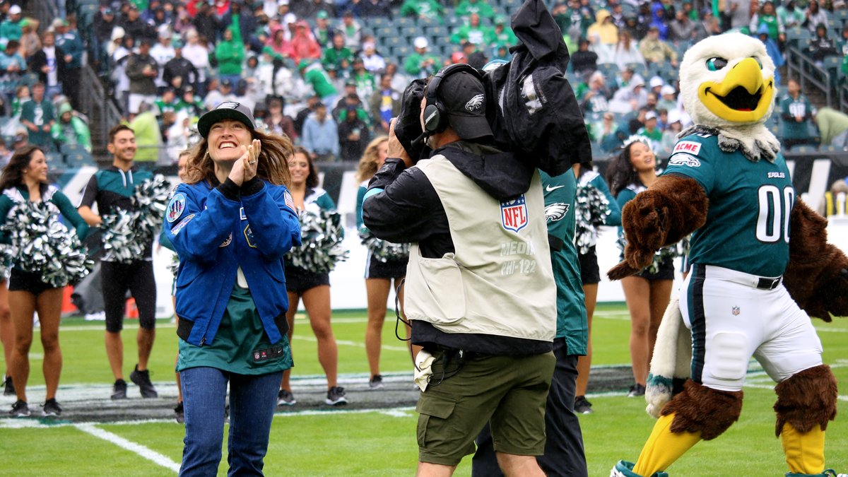 The Eagles mascot and cheerleaders stand on the turf at Lincoln Financial Field in Philadelphia