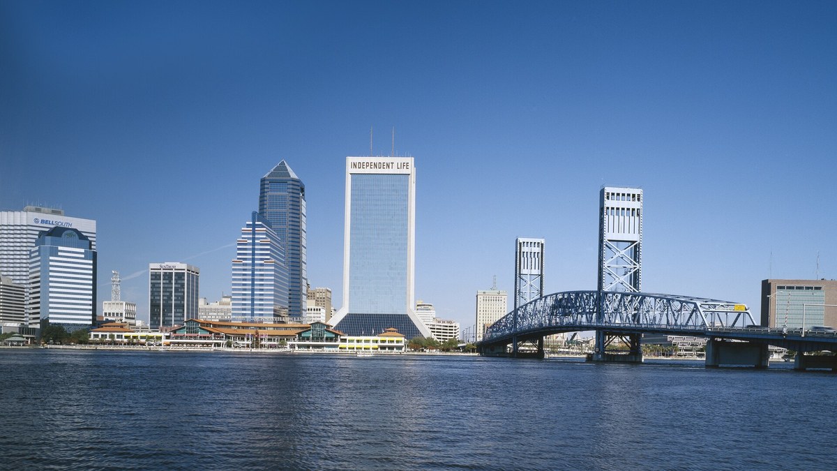 Downtown Jacksonville Florida skyline and Main Street Bridge across the St. Johns River under a clear blue sky