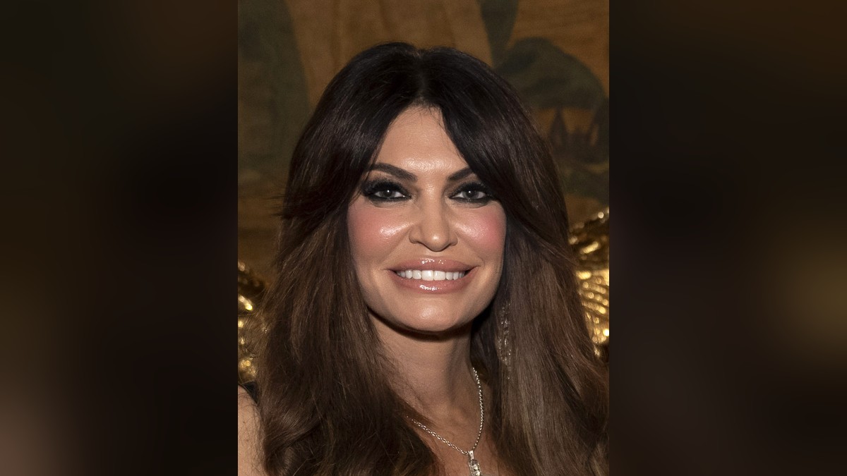 Kimberly Guilfoyle smiling at an evening event