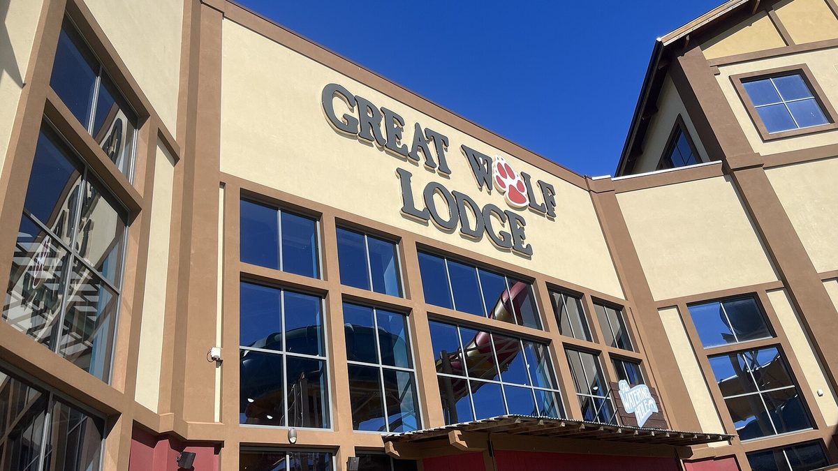Great Wolf Lodge exterior with lodge lettering under a clear blue sky
