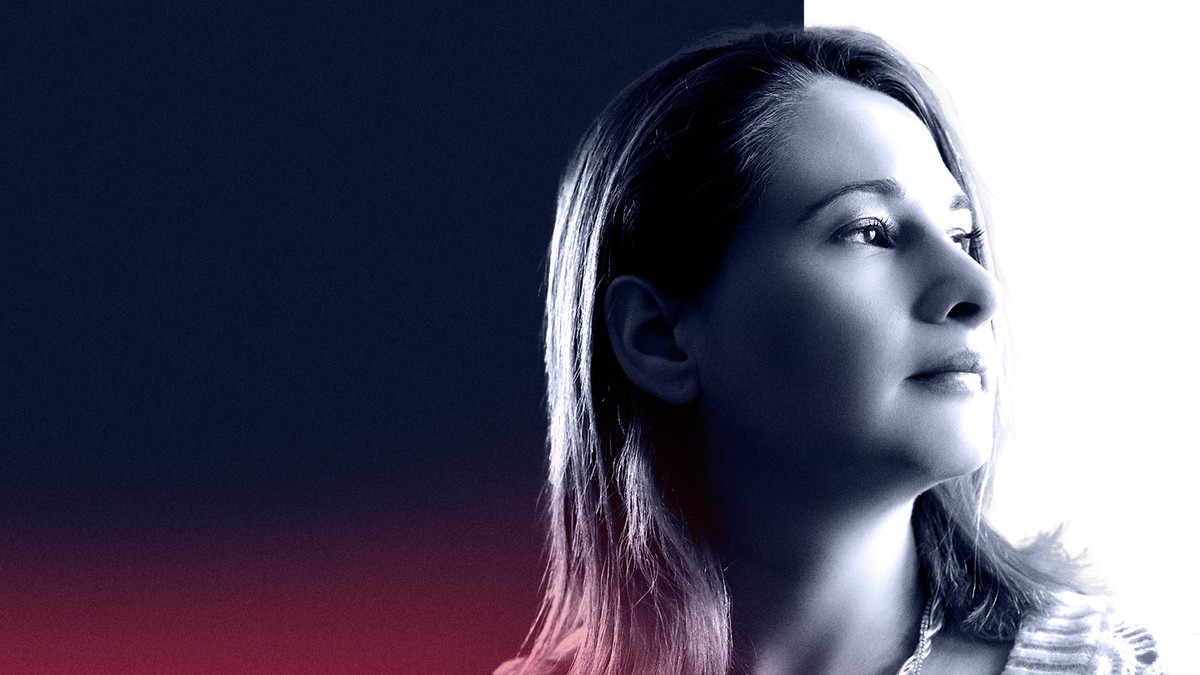 Gypsy Rose Blanchard in a soft profile portrait gazing to the right against a dark blue backdrop