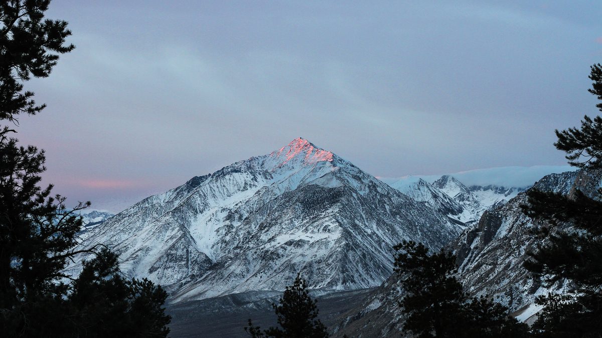 Snow-dusted peaks of California's Sierra Nevada at dawn