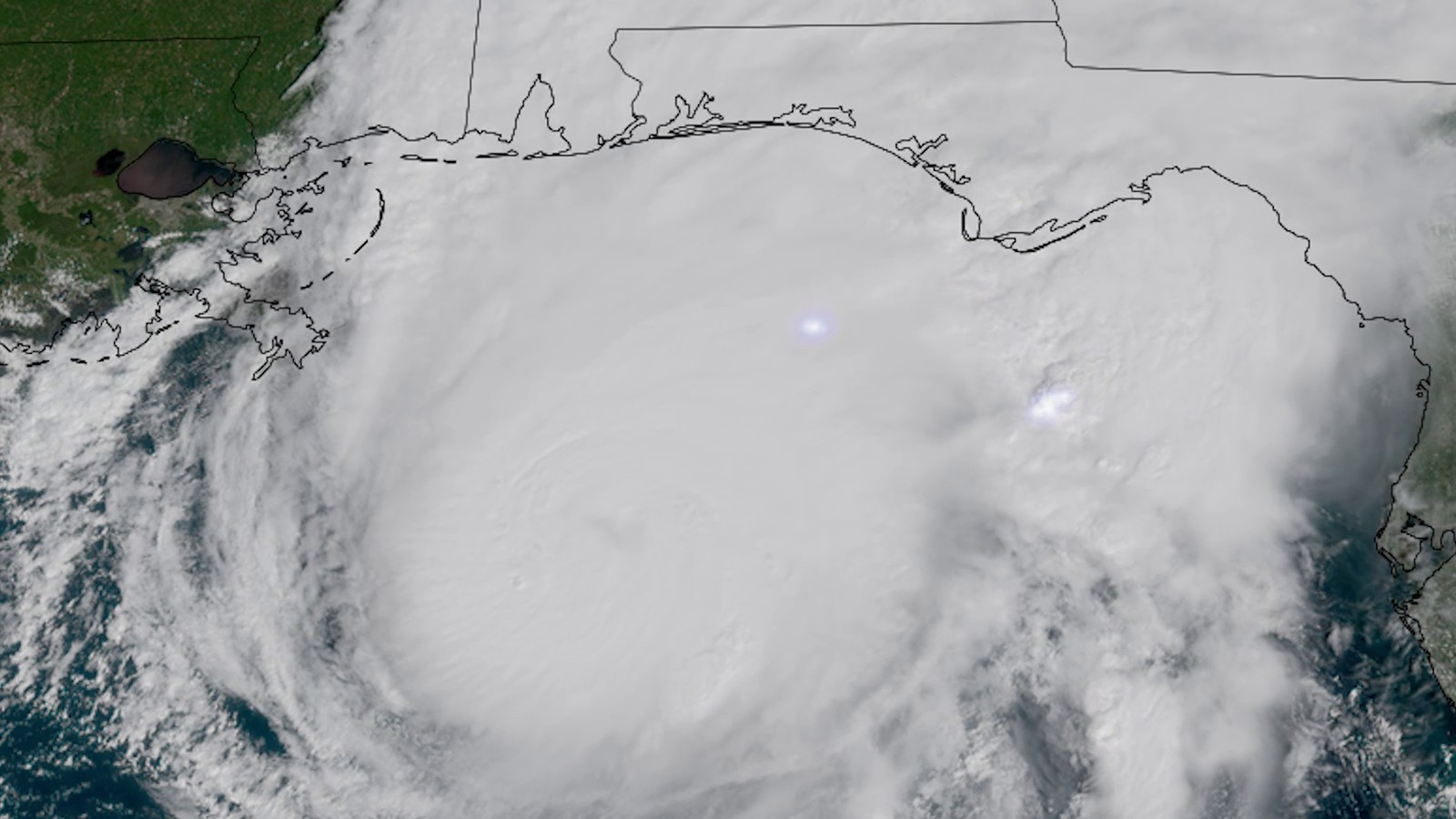 Satellite image of Hurricane Isaias as a huge white spiral of clouds over the northern Gulf off the Alabama and Florida coasts