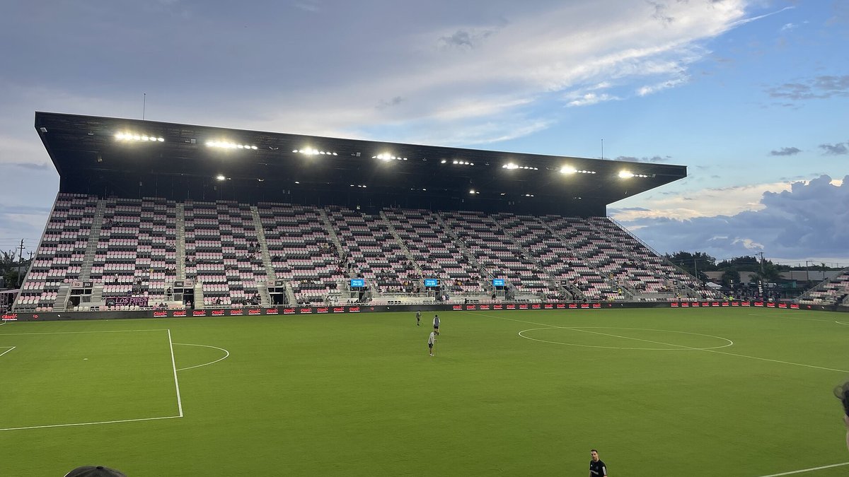 Floodlights shine over the pink-trimmed stands and green pitch at Inter Miami's former stadium in Fort Lauderdale