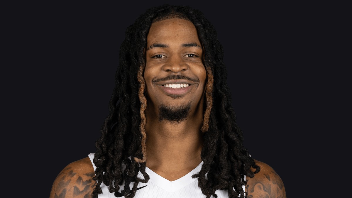 Ja Morant smiling in a white team jersey