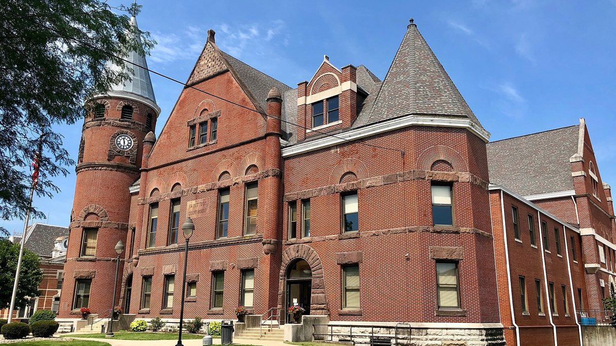 The red brick Fayette County Courthouse with its pointed corner tower in Connersville, Indiana