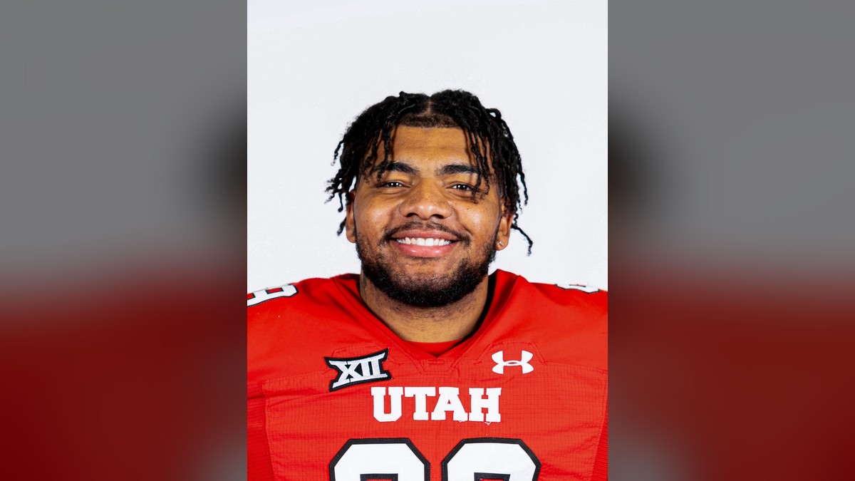 Jamal Wallace in a red Utah number 99 jersey in his team roster portrait
