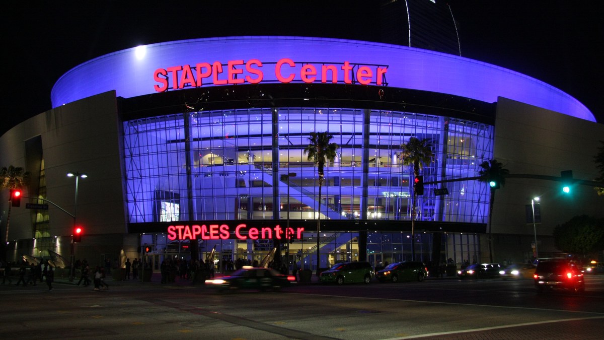 The arena then called Staples Center glowing purple at night in downtown Los Angeles