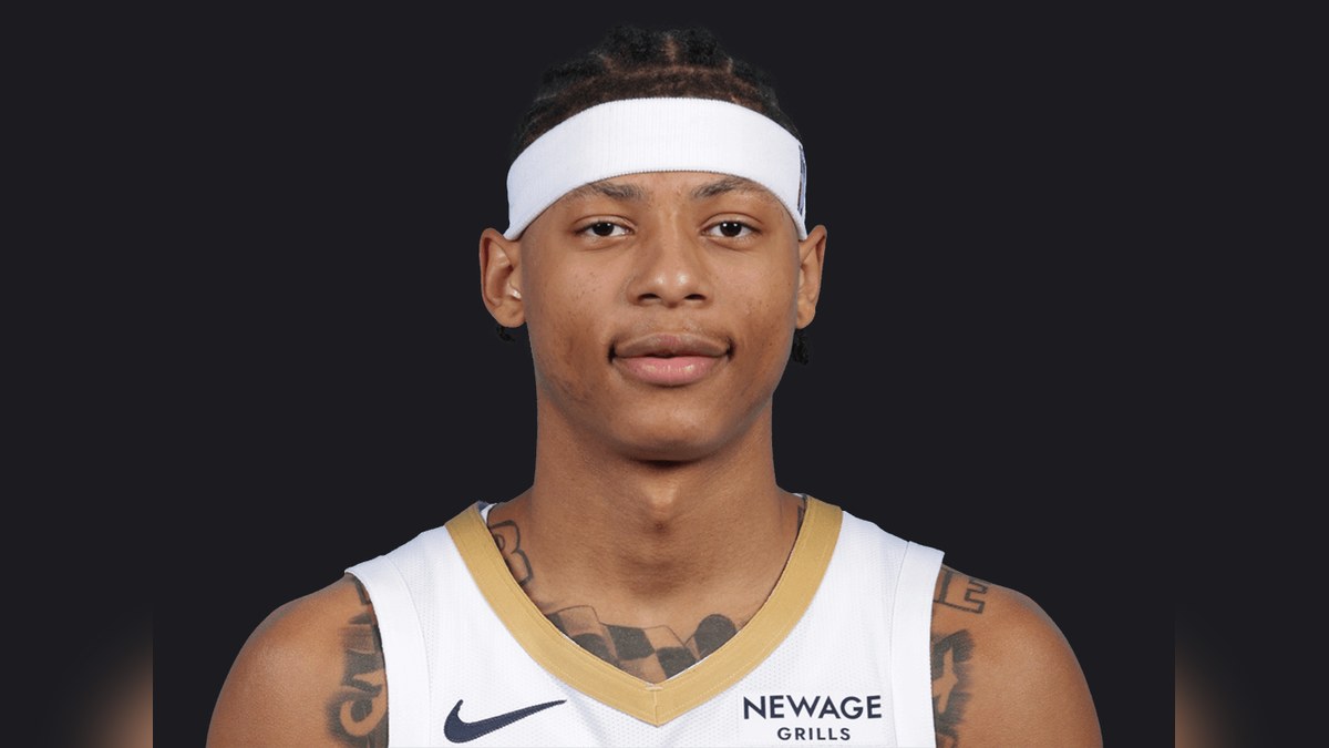 Jeremiah Fears in a white New Orleans Pelicans jersey and headband