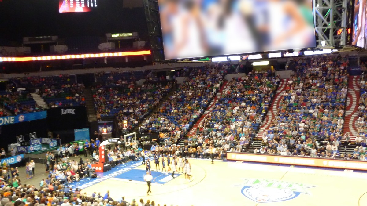 Fans fill the stands under the big center-hung video board at Target Center in Minneapolis during a basketball game
