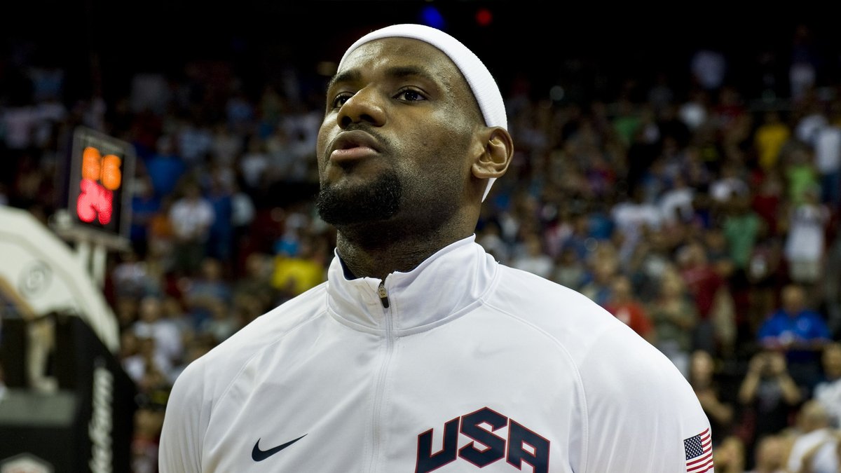 LeBron James in a white Team USA warmup jacket standing for the national anthem before a 2012 exhibition game in Las Vegas