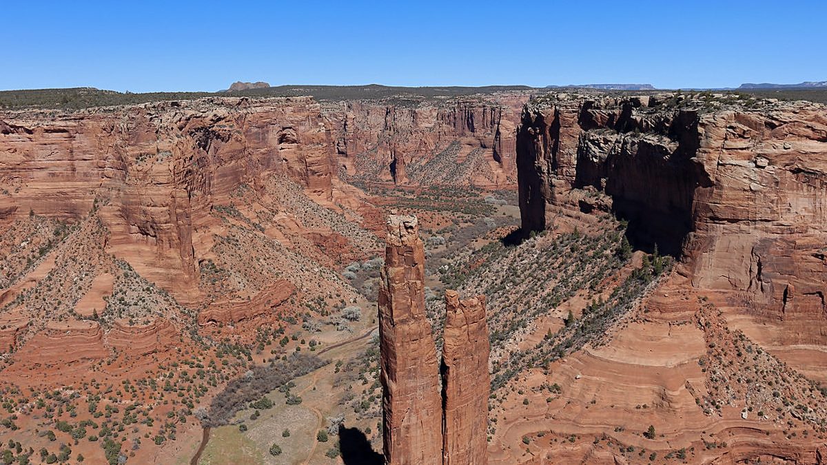Red rock cliffs of Canyon de Chelly on the Navajo Nation under a blue sky