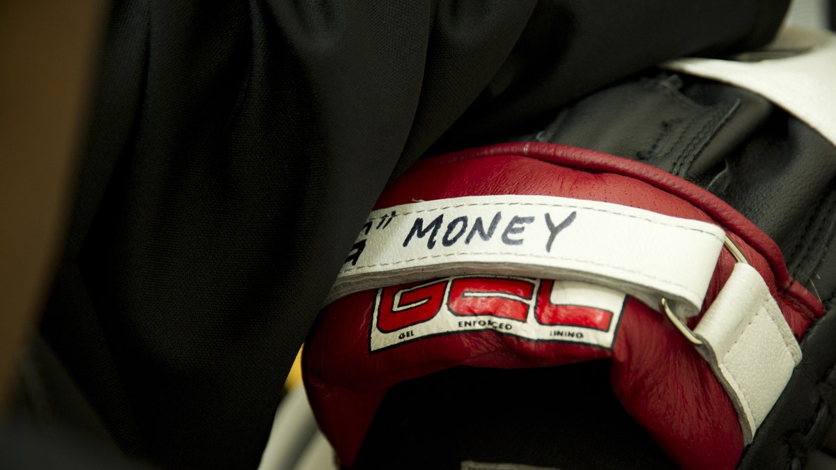 Close-up of a red boxing glove with a white strap at a boxing championship in San Antonio