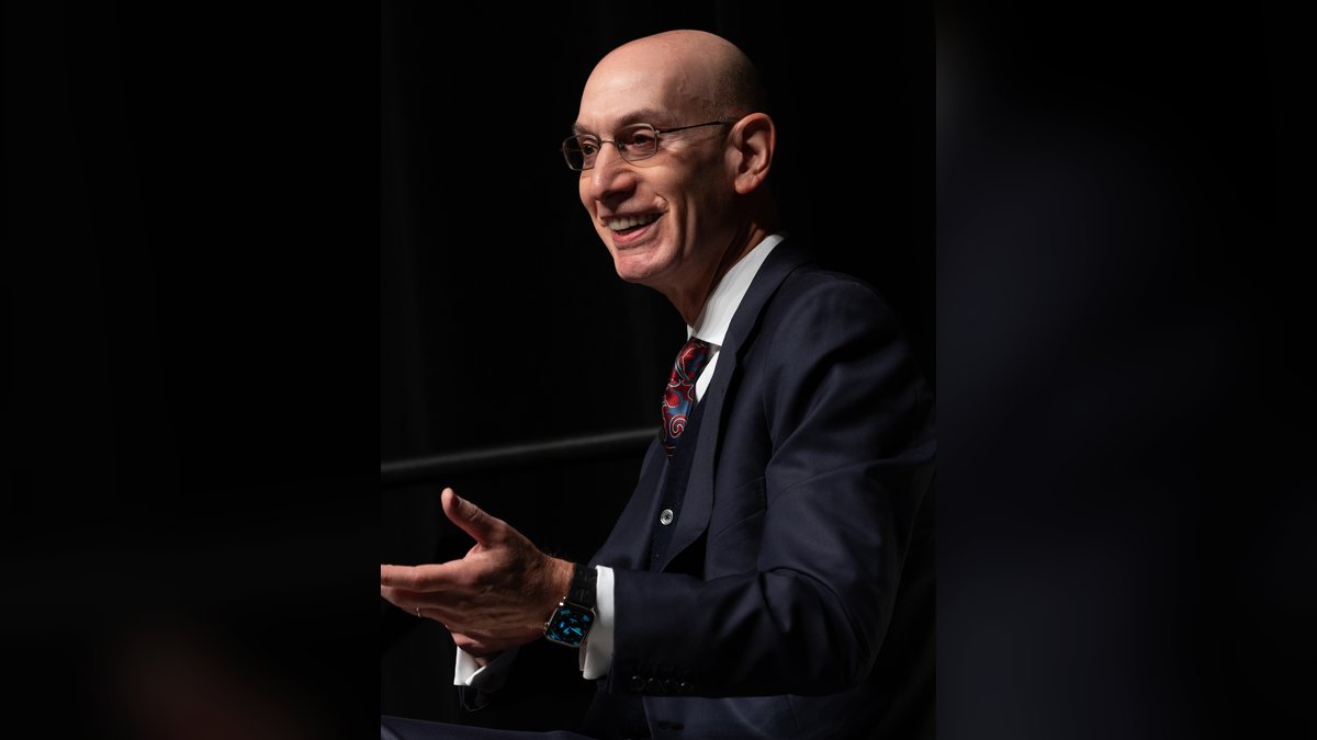 NBA commissioner Adam Silver smiles while speaking on stage during 2024 NBA All-Star events in Indianapolis