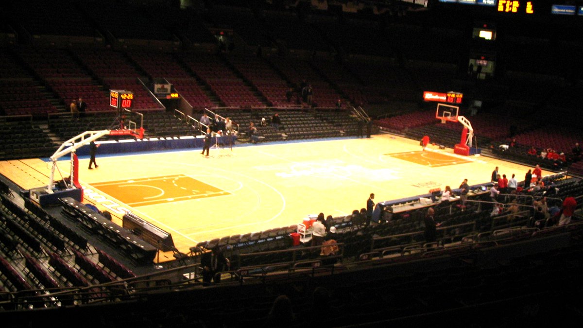 The basketball court inside Madison Square Garden in New York, home of the Knicks, sits under the arena lights with rows of seats rising around it