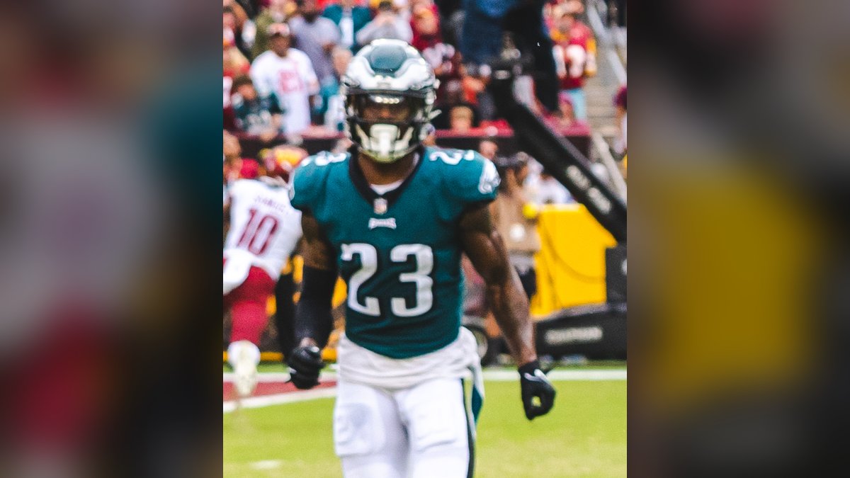 C.J. Gardner-Johnson in a green Eagles No. 23 jersey and white pants runs downfield during a September 2022 game