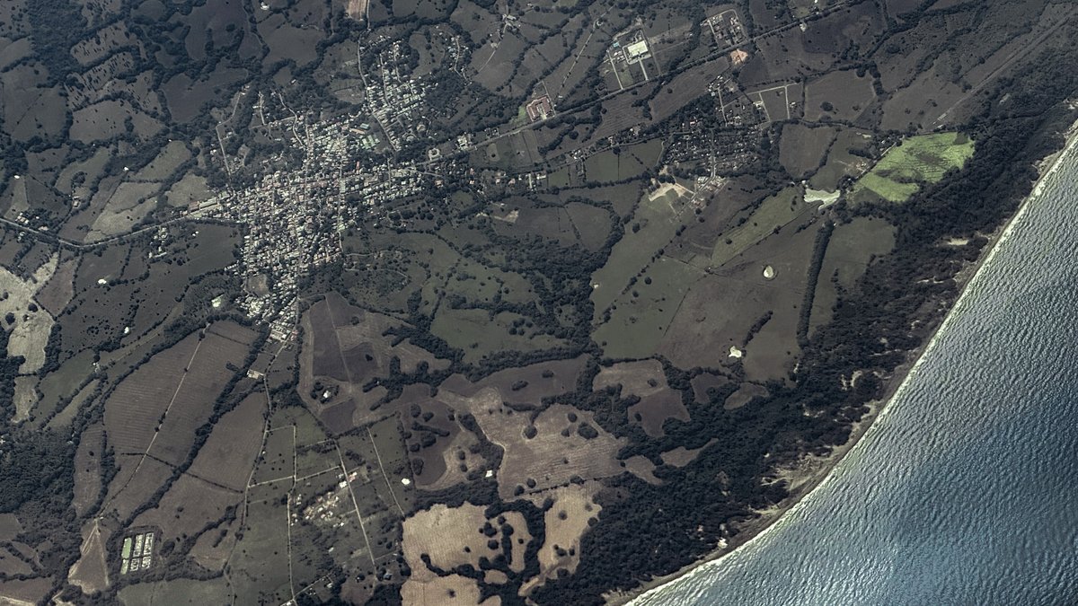 Aerial view of the town of Pedasí and farmland beside the Pacific coast of Panama