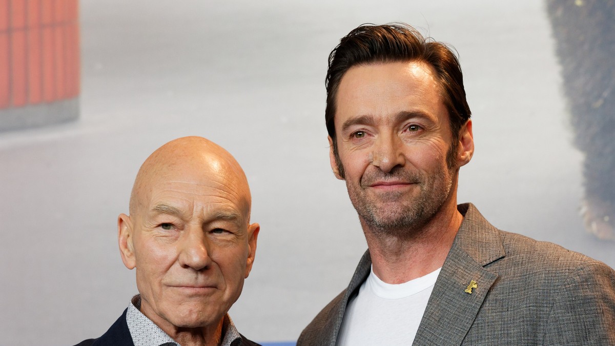 Patrick Stewart and Hugh Jackman standing side by side and smiling at a film festival photo call