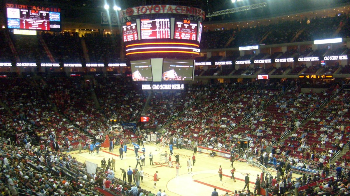 Fans fill the red seats around the court under the center-hung scoreboard inside Toyota Center in Houston