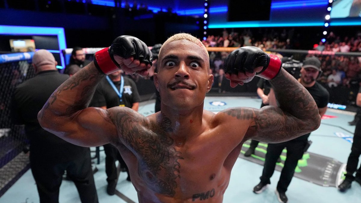 Sal Everett flexing both arms inside the UFC Octagon after his win