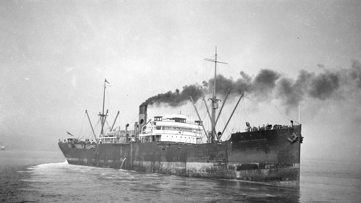 Black and white photo of the steamship Canadian Transporter, later renamed Cornwallis, steaming at sea with smoke rising