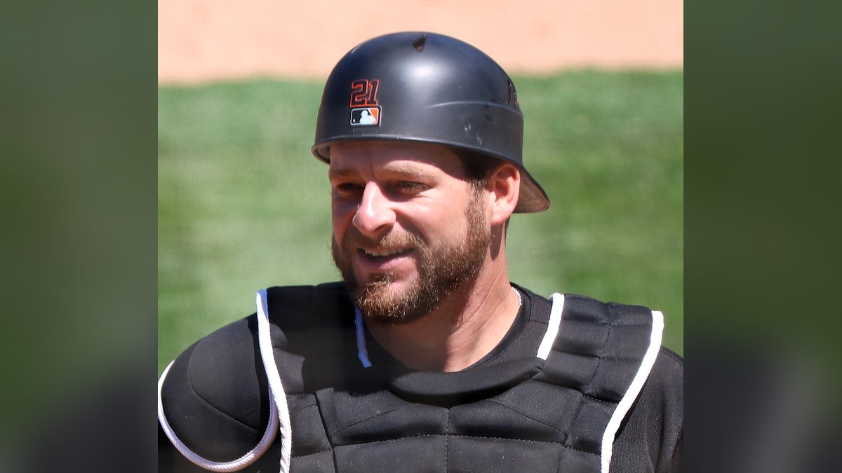 Stephen Vogt smiling in his catcher's gear and helmet during his playing days in 2019