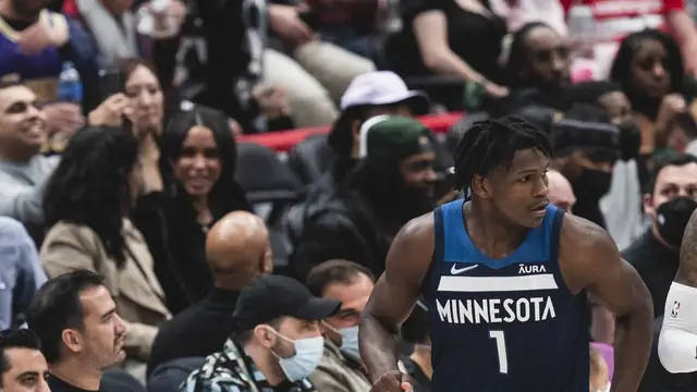 Anthony Edwards in a navy Minnesota Timberwolves No. 1 jersey on the court