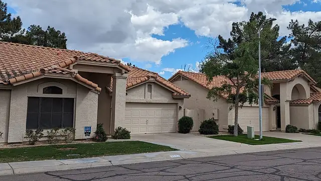 Stucco homes with tile roofs on a residential street in Tempe, Arizona