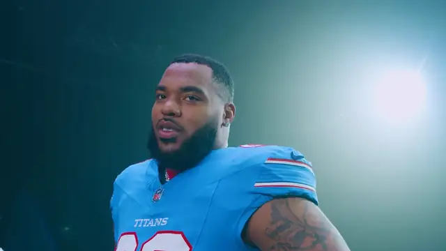 Jeffery Simmons in a light blue Tennessee Titans jersey during a team photo shoot