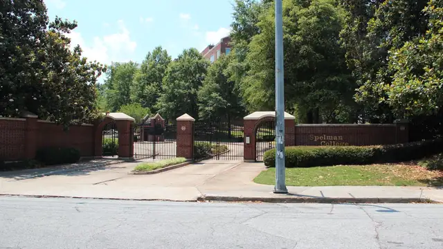 Brick gates and green lawn at the entrance to Spelman College in Atlanta, a partner campus of Camp HBCYouth