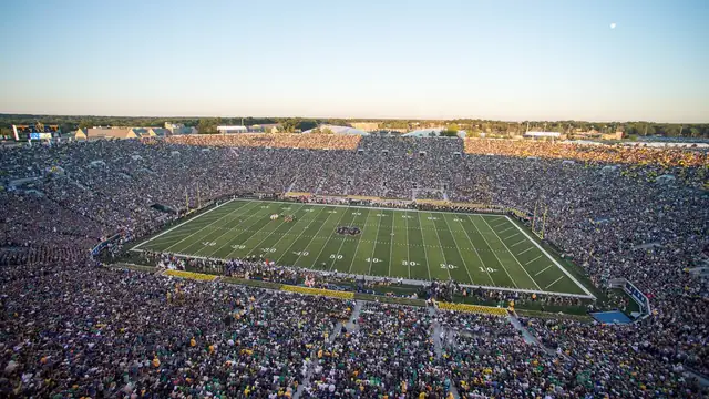 A packed Notre Dame Stadium with fans filling the stands around the field before a September 2014 football game