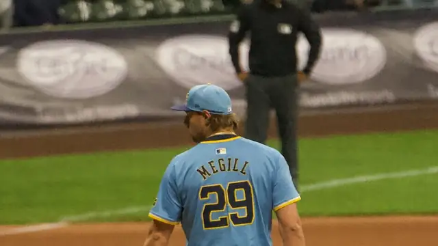 Brewers closer Trevor Megill, wearing No. 29, stands on the mound in a powder blue Milwaukee jersey