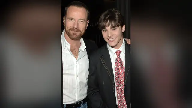 Bryan Cranston with his arm around a young RJ Mitte at an event