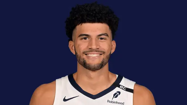 Cameron Boozer smiling in a white Memphis Grizzlies jersey