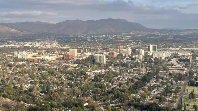 Aerial view of downtown Riverside California with mountains in the distance