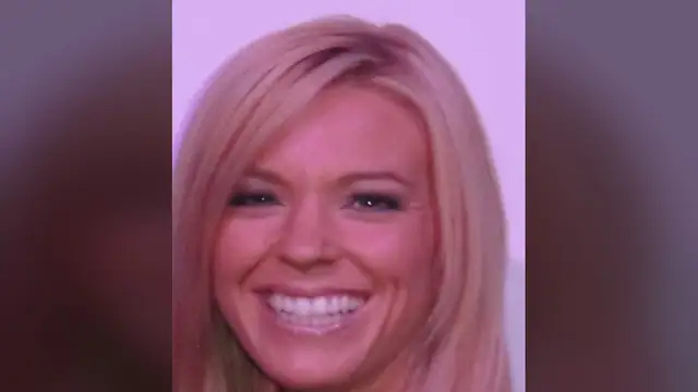 Kate Gosselin smiling in a close-up portrait