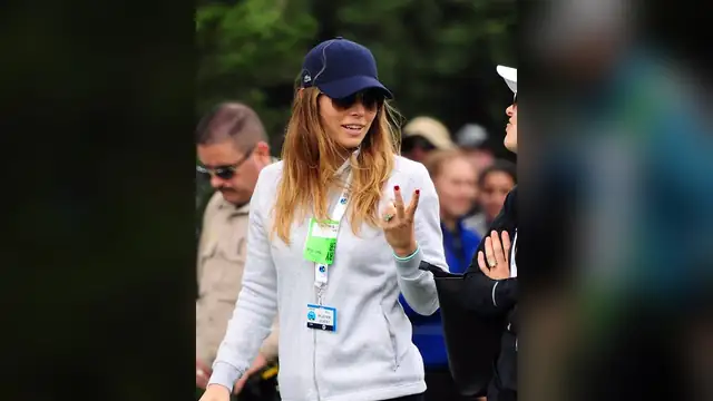 Jessica Biel in a navy cap at a golf tournament
