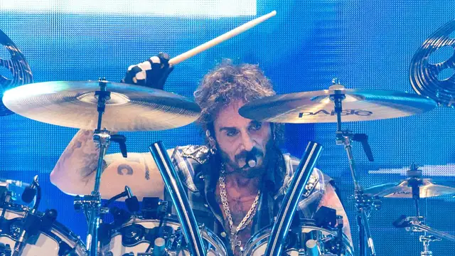 Deen Castronovo playing drums on stage with Journey