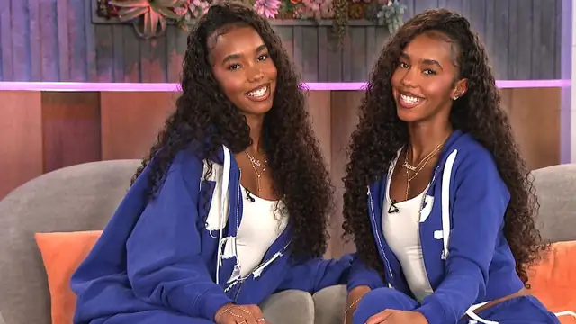Jessie and D'Lila Combs smiling side by side on a couch in matching blue tracksuits